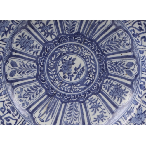 624 - A large Chinese blue & white shallow bowl decorated with flowers, 41cms diameter (restored).