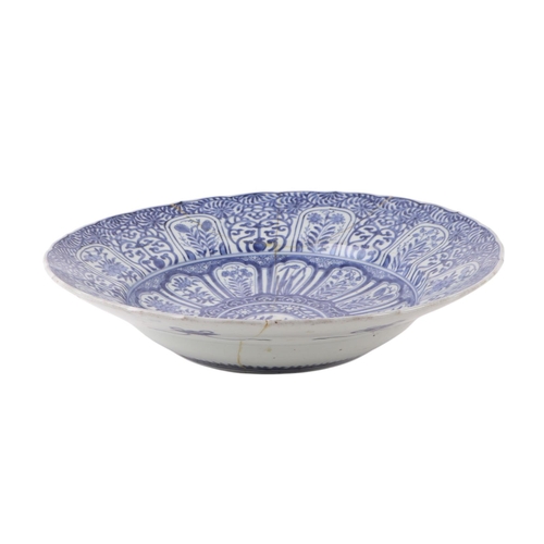 624 - A large Chinese blue & white shallow bowl decorated with flowers, 41cms diameter (restored).