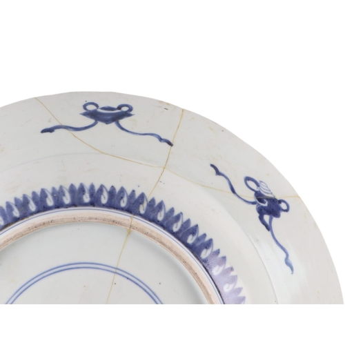 624 - A large Chinese blue & white shallow bowl decorated with flowers, 41cms diameter (restored).