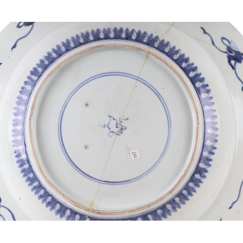 624 - A large Chinese blue & white shallow bowl decorated with flowers, 41cms diameter (restored).