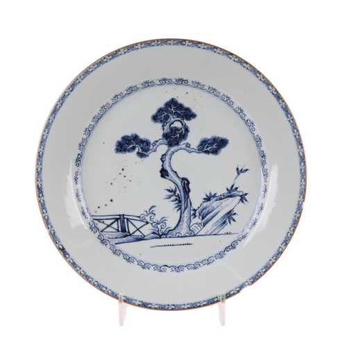 625 - A Chinese blue charger decorated with a fir tree and a fence, 36cms diameter.