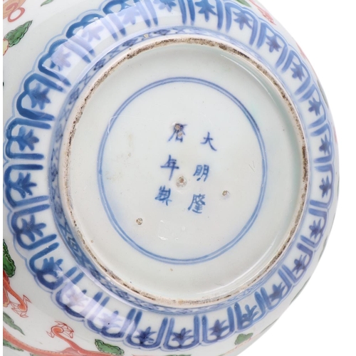 629 - A Chinese Imari palette bowl decorated with dragons and mythical beasts, six character blue mark to ... 