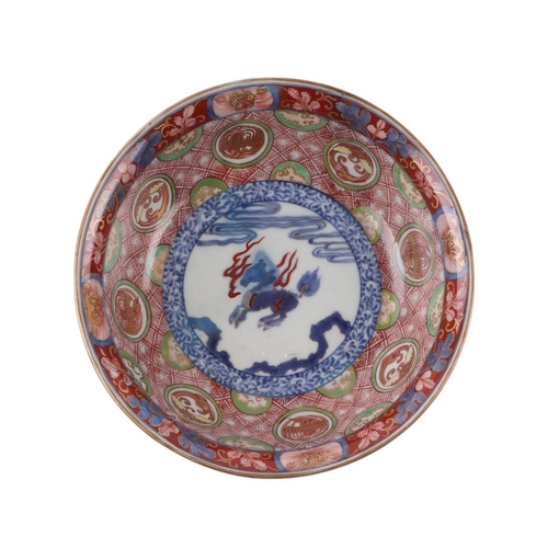 629 - A Chinese Imari palette bowl decorated with dragons and mythical beasts, six character blue mark to ... 