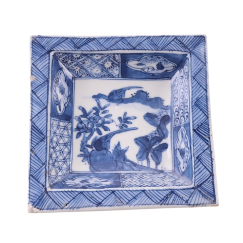 630 - A Chinese blue & white dish decorated with a fish in a pond, 17cms diameter; together with a Chinese... 