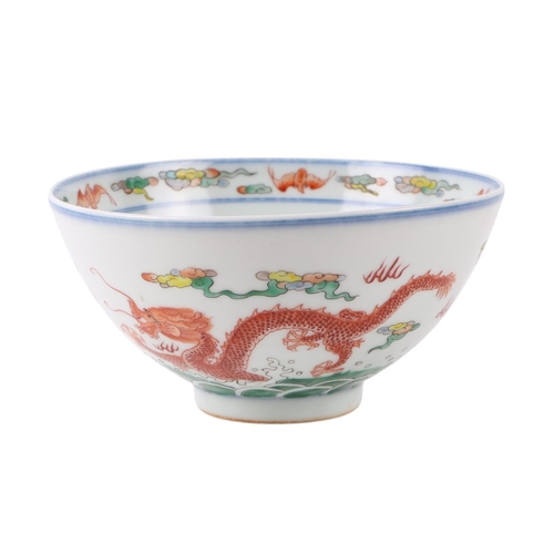 633 - A Chinese Ducai style footed bowl decorated with dragons amongst clouds with red capped cranes to th... 