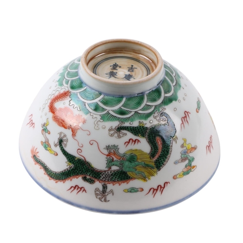 633 - A Chinese Ducai style footed bowl decorated with dragons amongst clouds with red capped cranes to th... 