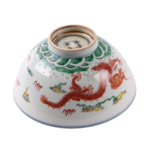 633 - A Chinese Ducai style footed bowl decorated with dragons amongst clouds with red capped cranes to th... 