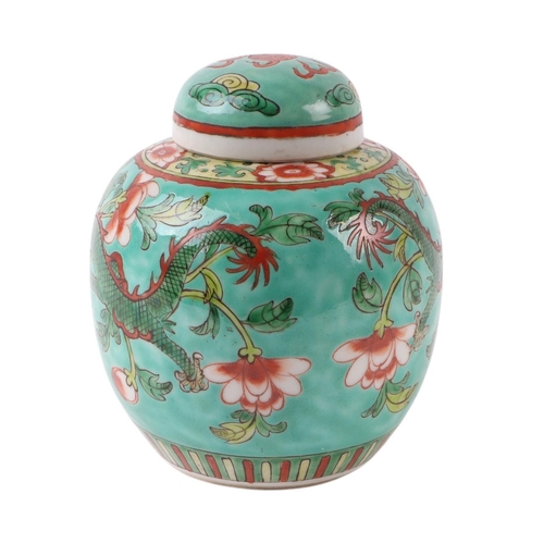 634 - A Chinese famille rose ginger jar and cover decorated with dragons on a green ground, 14cms high.