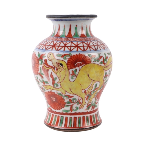 636 - A Chinese Ducai style baluster vase decorated with mythical beasts and flowers, six character blue m... 