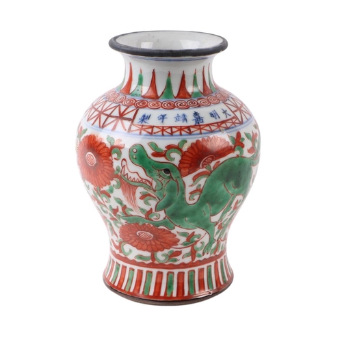 636 - A Chinese Ducai style baluster vase decorated with mythical beasts and flowers, six character blue m... 