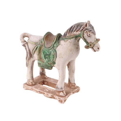 640 - A Chinese Tang style pottery horse, 27cms high.