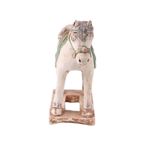 640 - A Chinese Tang style pottery horse, 27cms high.