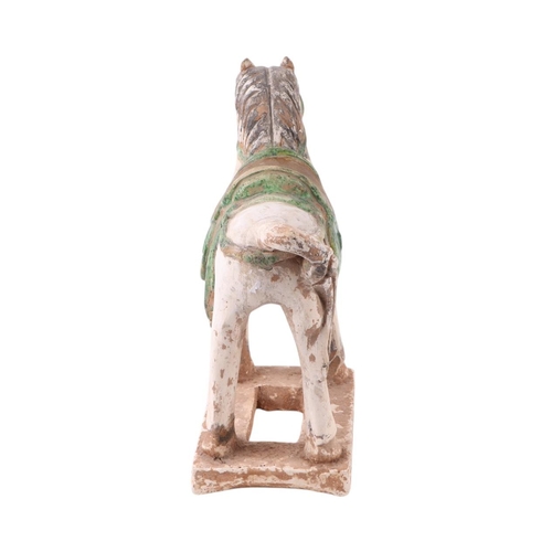 640 - A Chinese Tang style pottery horse, 27cms high.