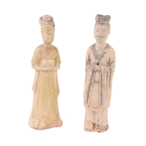 642 - A pair of Chinese pottery funerary figures, possibly Tang Dynasty, the largest 21cms high (2).