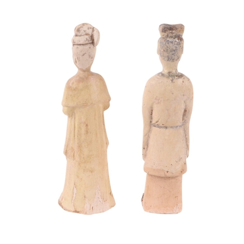 642 - A pair of Chinese pottery funerary figures, possibly Tang Dynasty, the largest 21cms high (2).