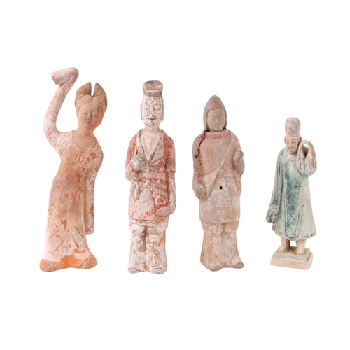 643 - A group of Chinese pottery funerary figures, possibly Tang Dynasty, the largest 27cms high (4).