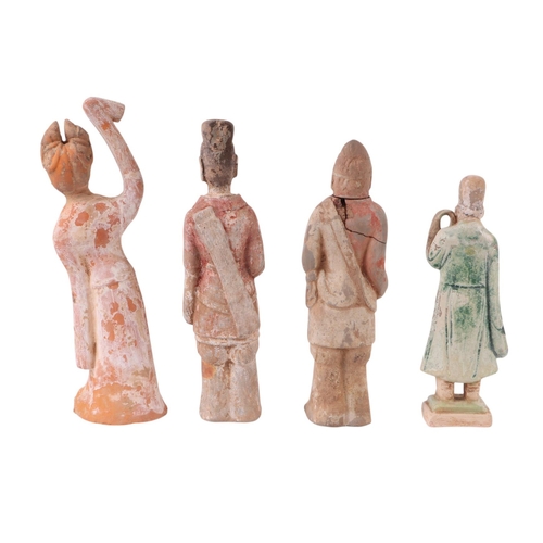 643 - A group of Chinese pottery funerary figures, possibly Tang Dynasty, the largest 27cms high (4).