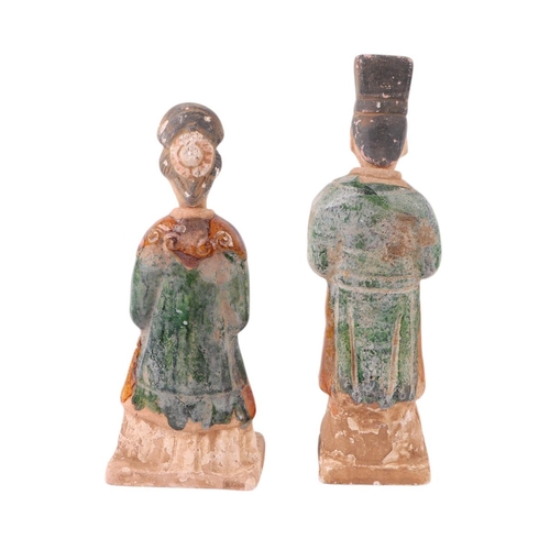 644 - A pair of Chinese glazed funerary figures, possibly Tang Dynasty, the largest 25cms high (2).