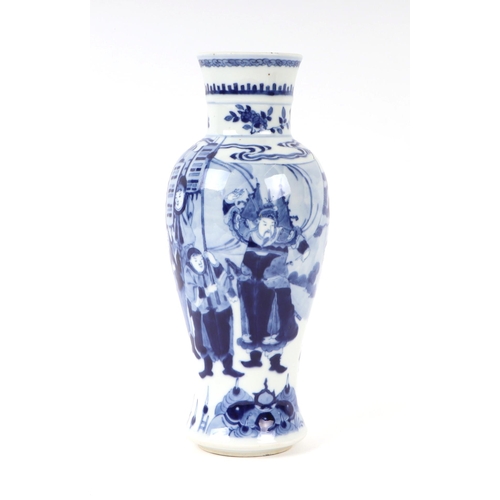 648 - A Chinese blue & white baluster vase decorated with figures in a landscape, 25cms high.