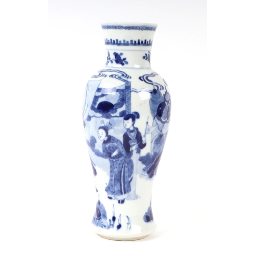 648 - A Chinese blue & white baluster vase decorated with figures in a landscape, 25cms high.