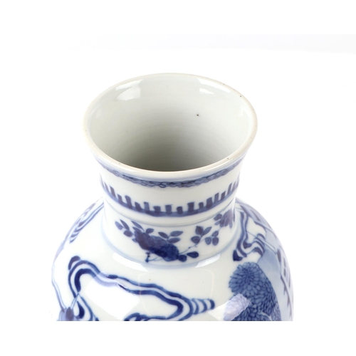 648 - A Chinese blue & white baluster vase decorated with figures in a landscape, 25cms high.