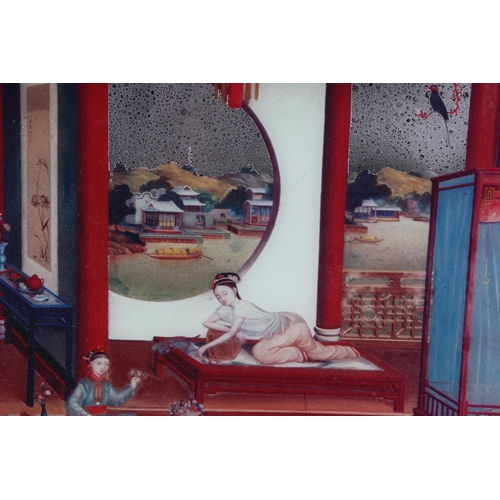 655 - A Chinese reverse decorated silvered mirror picture depicting a boudoir scene, framed, 40 by 30cms.