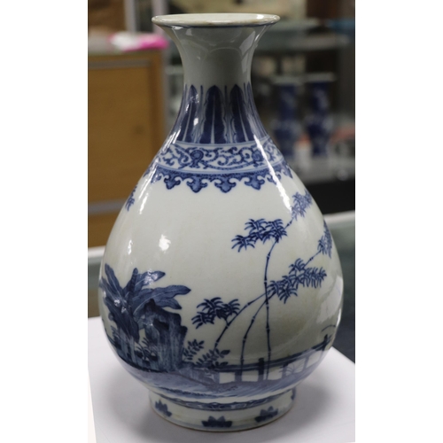 662 - A Chinese blue & white vase decorated with bamboo and foliage on a terrace, blue seal mark to the un... 