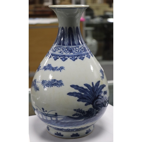 662 - A Chinese blue & white vase decorated with bamboo and foliage on a terrace, blue seal mark to the un... 