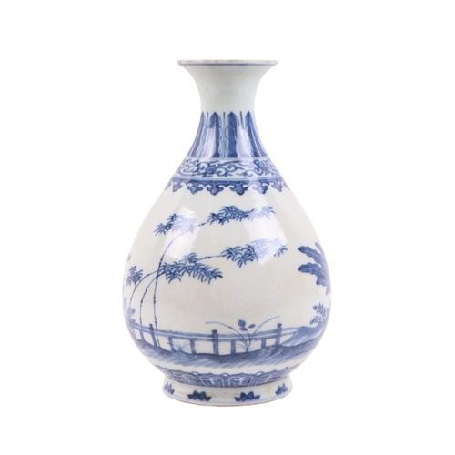 662 - A Chinese blue & white vase decorated with bamboo and foliage on a terrace, blue seal mark to the un... 