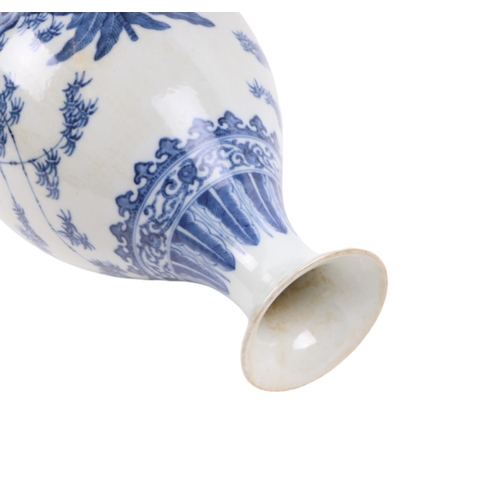 662 - A Chinese blue & white vase decorated with bamboo and foliage on a terrace, blue seal mark to the un... 