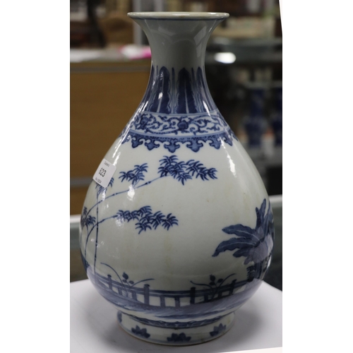 662 - A Chinese blue & white vase decorated with bamboo and foliage on a terrace, blue seal mark to the un... 