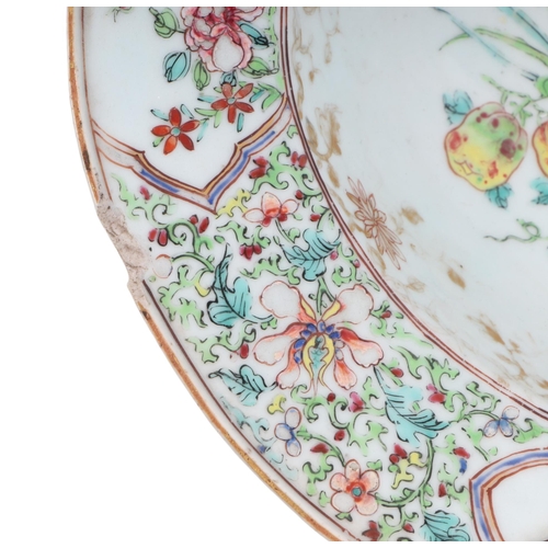 663 - A Chinese Export famille rose barber's bowl decorated with flowers, 33cms wide.Condition ReportThere... 