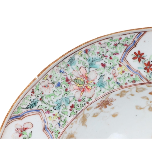 663 - A Chinese Export famille rose barber's bowl decorated with flowers, 33cms wide.Condition ReportThere... 