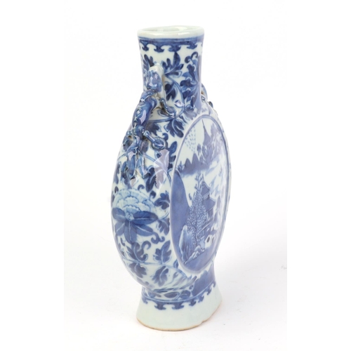 667 - A Chinese blue & white moon flask decorated with a river landscape scene, 22cms high.