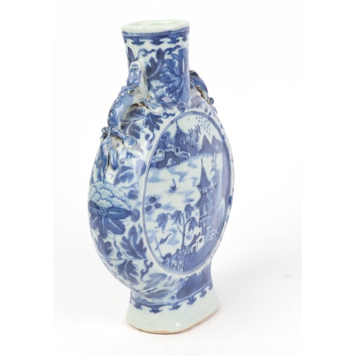 667 - A Chinese blue & white moon flask decorated with a river landscape scene, 22cms high.