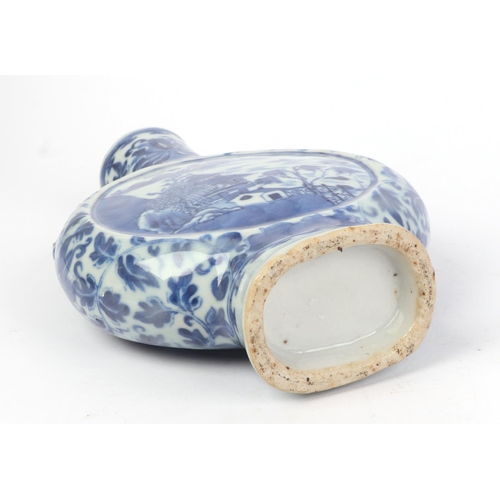 667 - A Chinese blue & white moon flask decorated with a river landscape scene, 22cms high.