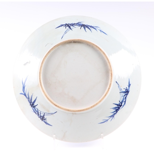 671 - A Chinese blue & white charger decorated with foliate scrolls, 37cms diameter; together with a Chine... 