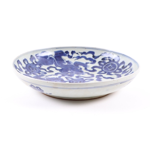 671 - A Chinese blue & white charger decorated with foliate scrolls, 37cms diameter; together with a Chine... 