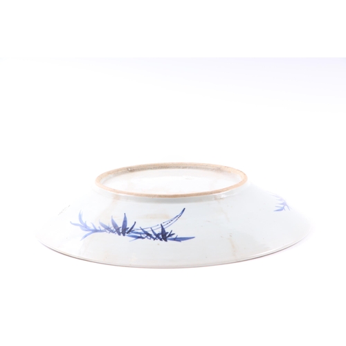 671 - A Chinese blue & white charger decorated with foliate scrolls, 37cms diameter; together with a Chine... 