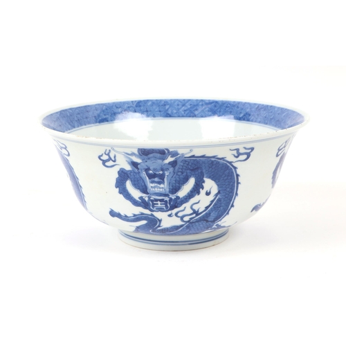 673 - A Chinese blue & white bowl decorated with dragons, 20cms diameter; together with a Chinese blue & w... 