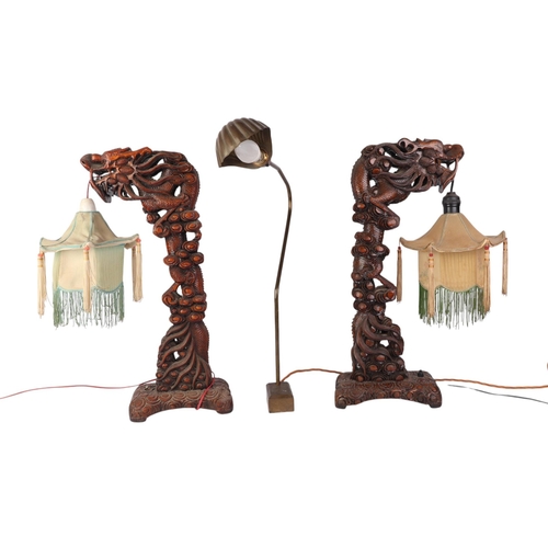 682 - A pair of 1930's Chinese carved wooden dragon table lamps, 52cms high; together with a brass desk la... 