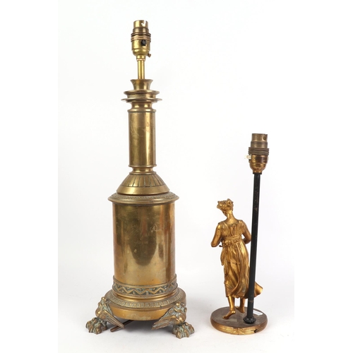 683 - A figural gilt bronze / brass lamp base, 31cms high; together with a Victorian brass lamp base with ... 