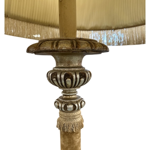 700 - A French giltwood and fabric standard lamp on lion paw feet, 130cm high.