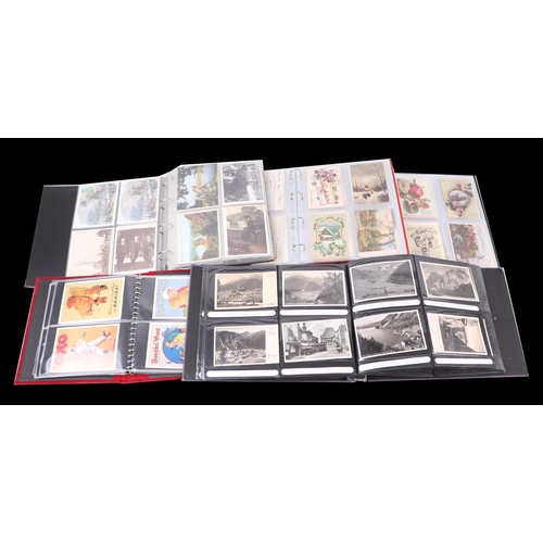 713 - A large quantity of postcards, loose and in albums to include topographical, Edwardian birthday and ... 