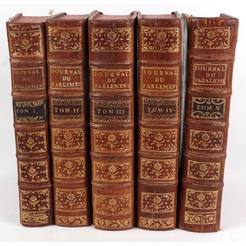 714 - A quantity of 18th century and later leather bound books.