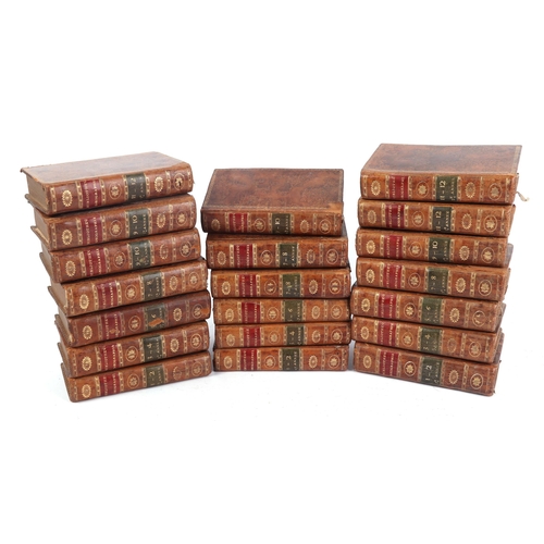 714 - A quantity of 18th century and later leather bound books.