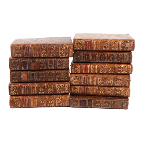 714 - A quantity of 18th century and later leather bound books.