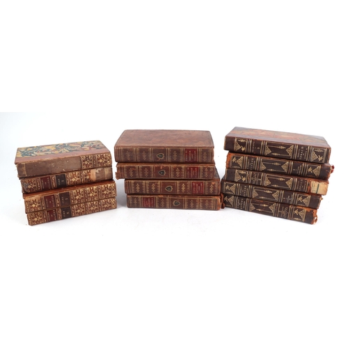 714 - A quantity of 18th century and later leather bound books.