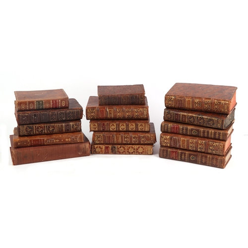 714 - A quantity of 18th century and later leather bound books.