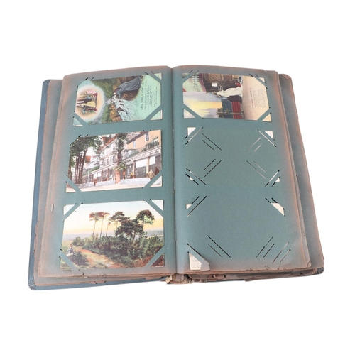 716 - A collection of postcard albums, mostly complete, with topographical and comical examples; together ... 